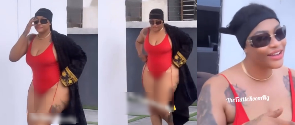 Fans reacts as Angela Okorie is seen covering her backside in raunchy swimsuit