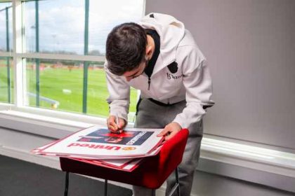 Win signed Fernandes posters