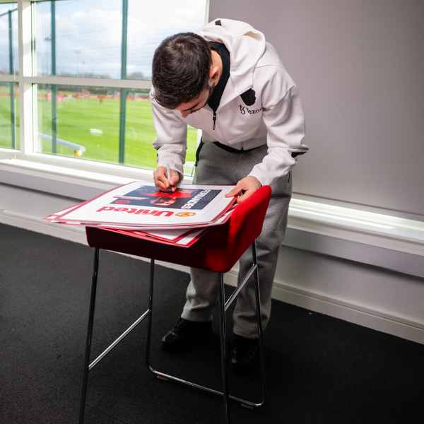 Win signed Fernandes posters