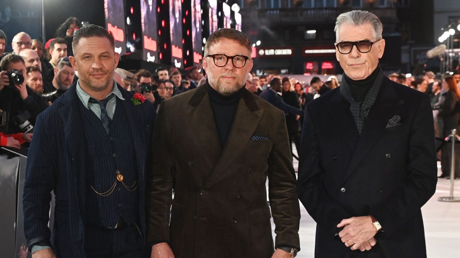Pierce Brosnan and Tom Hardy cut stylish figures as they lead stars at MobLand premiere