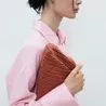 This raffia clutch bag is the perfect high street alternative to Bottega Veneta’s pouch bag