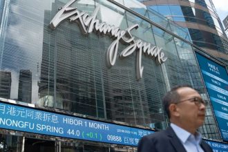 Asian stocks drop after Fed warning, oil dips with Mideast in focus