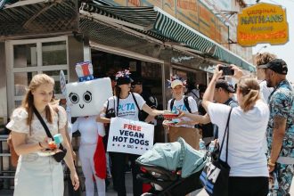 PETA distributes vegan wieners outside Nathan’s Hot Dog Eating Contest