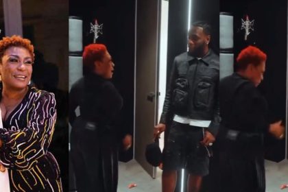Burna Boy Blushes as Mom Hypes Him in New Video
