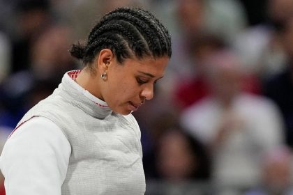 French Olympic fencer’s kiss contamination defense holds up in court as she’s cleared of doping violation