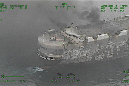 Tug reaches flaming ship carrying electric cars off Alaska coast