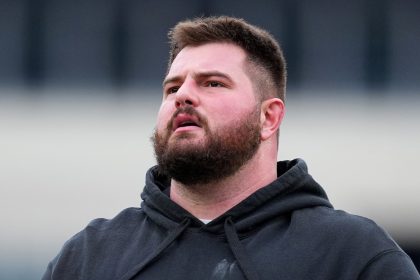 Landon Dickerson walking around after Eagles practice one day after knee procedure