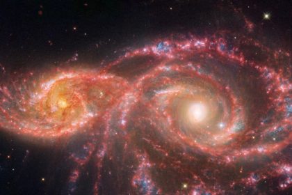 This galaxy sends a destructive ray at another galaxy