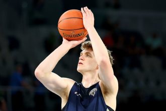Australian basketball player fractures back after backboard crashes down during practice