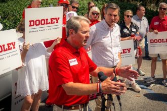 Gov. Brian Kemp endorses former football coach Derek Dooley outside Georgia stadium for 2026 US Senate bid