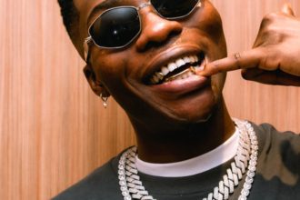 Reekado Banks fires back after critic mocks him for attending church