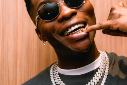 Reekado Banks fires back after critic mocks him for attending church