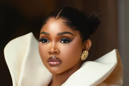 Mercy Aigbe Is Serving Monday Office Glam in This Ivory Coat Dress