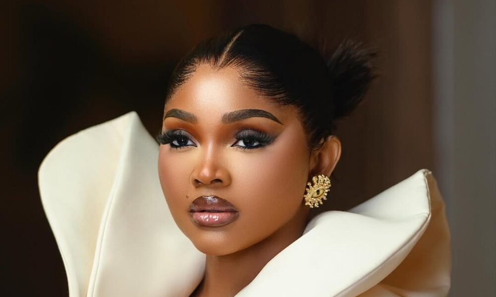 Mercy Aigbe Is Serving Monday Office Glam in This Ivory Coat Dress