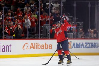 Alex Ovechkin becomes first NHL player to reach 900 goals as opposing goalie tries to hide milestone puck