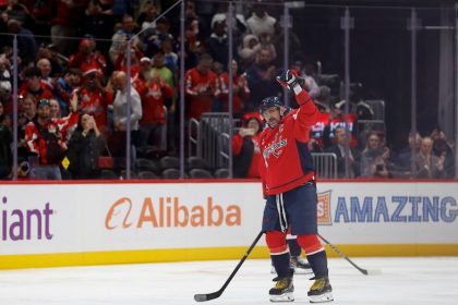 Alex Ovechkin becomes first NHL player to reach 900 goals as opposing goalie tries to hide milestone puck