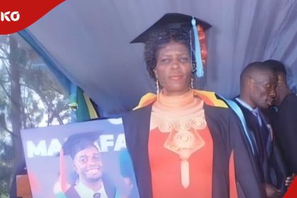 Grieving mum wears graduation gown, carries photo of son who died in election violence