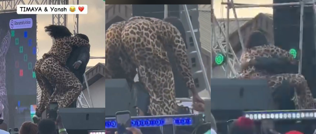 Moment Timaya Falls On Stage While Trying To Lift Plus-Sized Woman During Performance