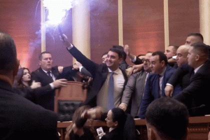 Albanian opposition lawmakers light flares, scuffle with police amid parliament chaos over corruption probe