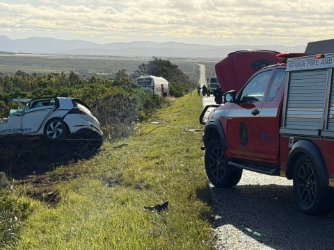 A traffic officer has died following a head-on collision with a bus